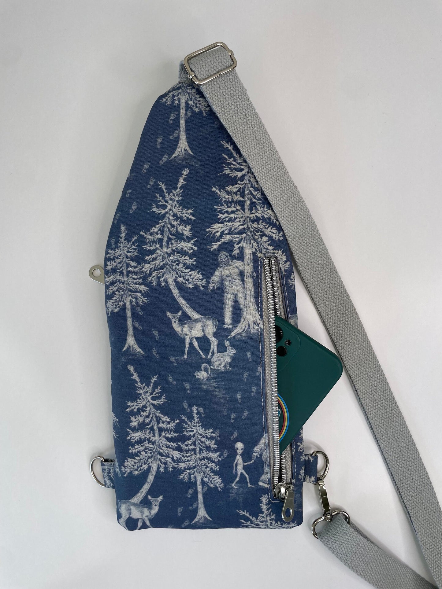 Thin and Compact Bigfoot Sling Bag Featuring Alien Friend