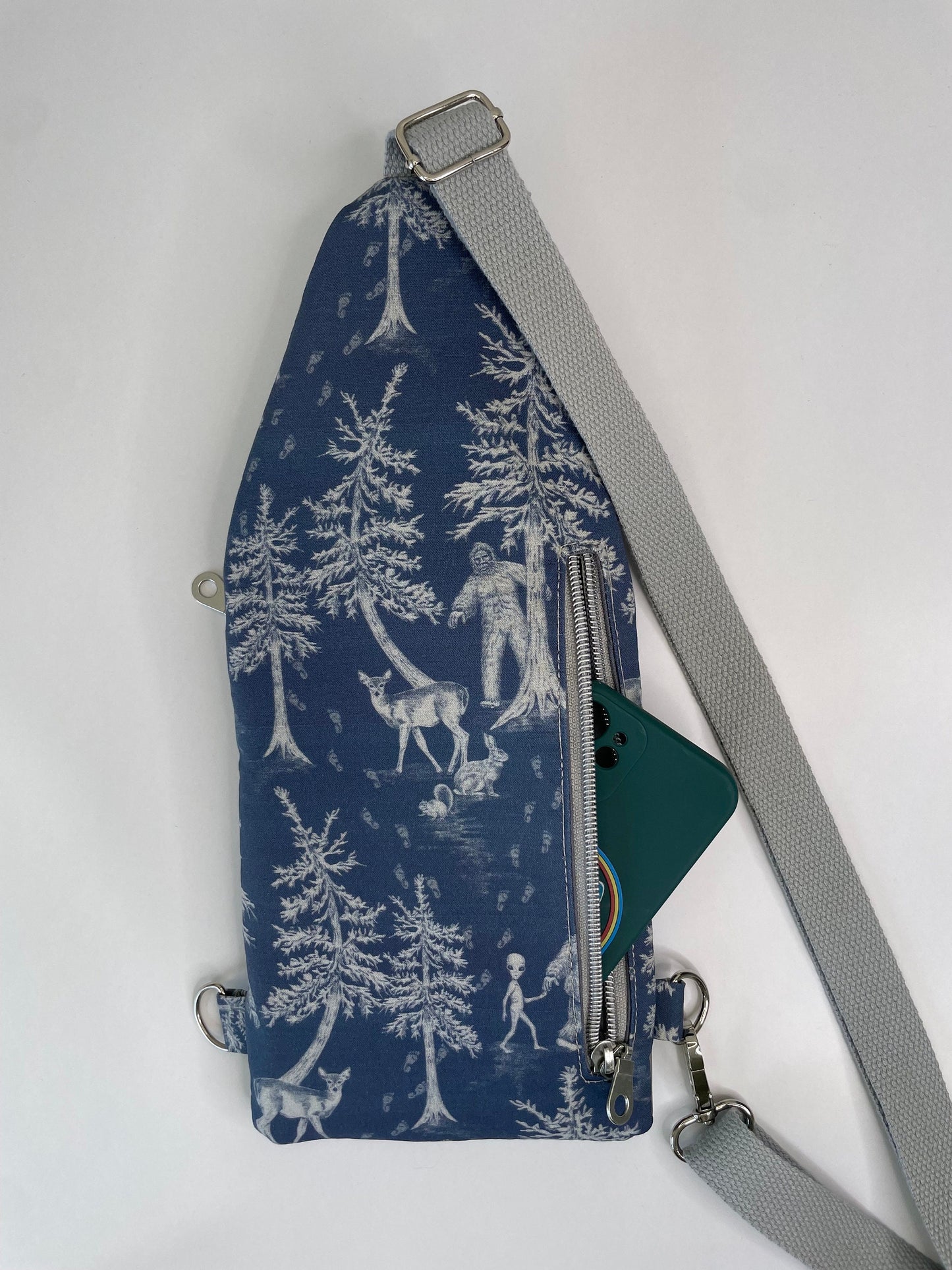Thin and Compact Bigfoot Sling Bag Featuring Alien Friend
