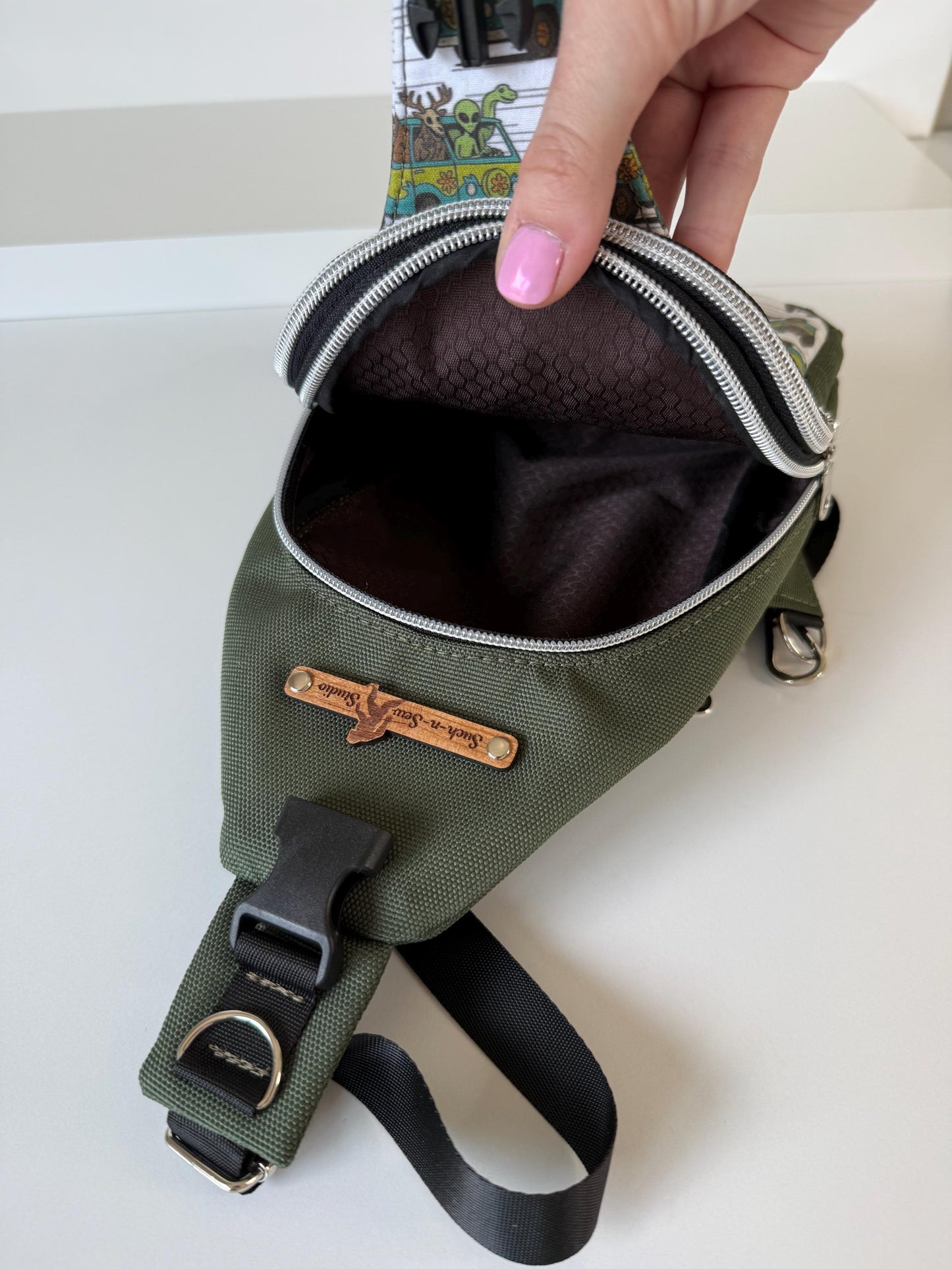 Cryptids in Mystery Machine Sling Bag that's Surprisingly Spacious