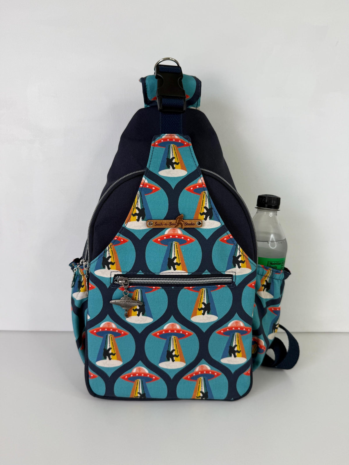 Groovy Alien Abducting Bigfoot Convertible Backpack Crossbody Sling