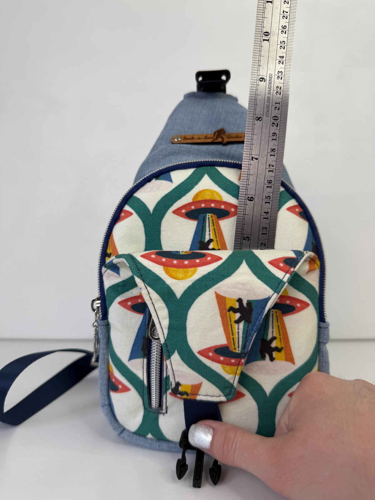 Alien Abducting Bigfoot Sling Crossbody Bag