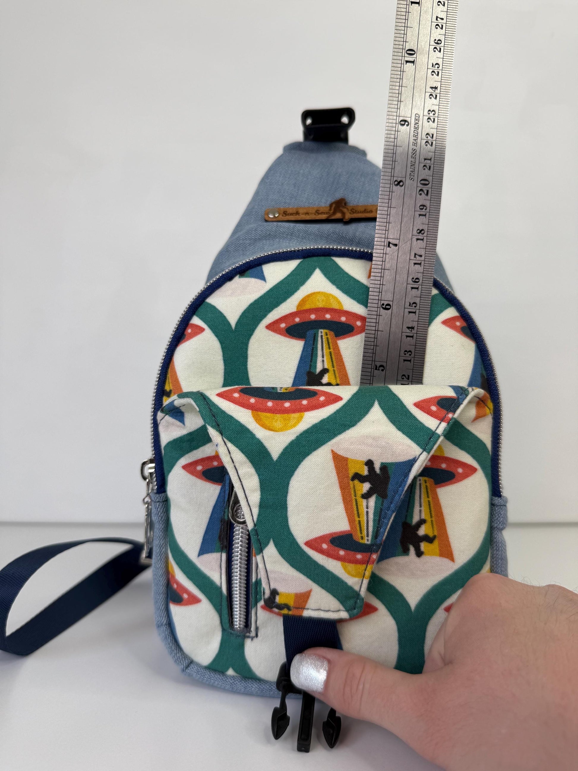 Alien Abducting Bigfoot Sling Crossbody Bag
