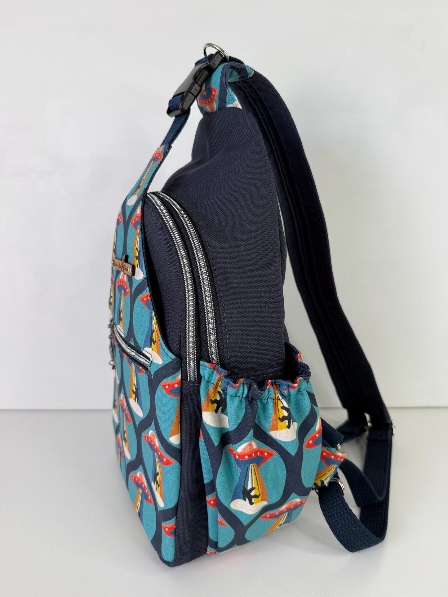 Groovy Alien Abducting Bigfoot Convertible Backpack Crossbody Sling