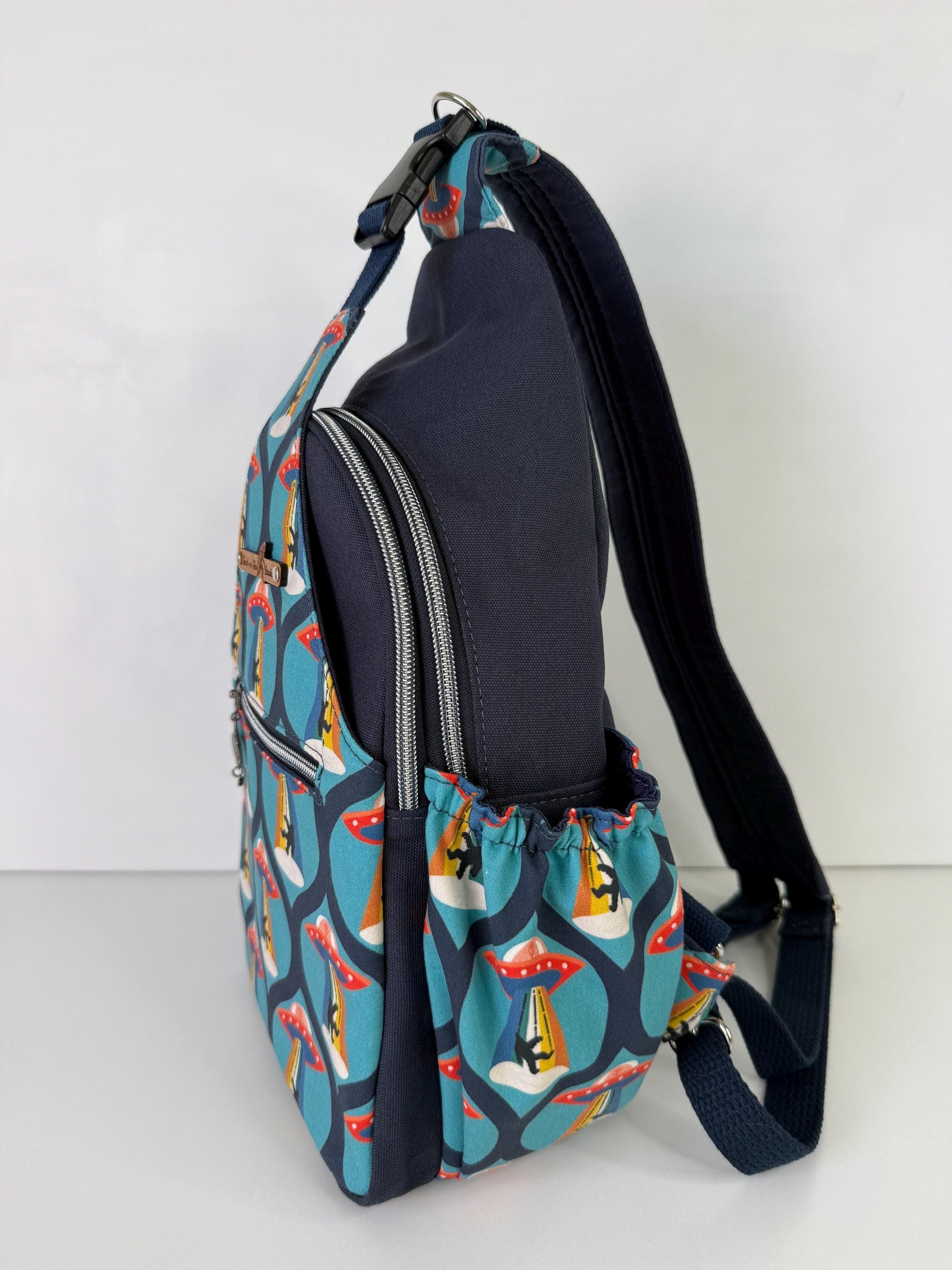 Groovy Alien Abducting Bigfoot Convertible Backpack Crossbody Sling