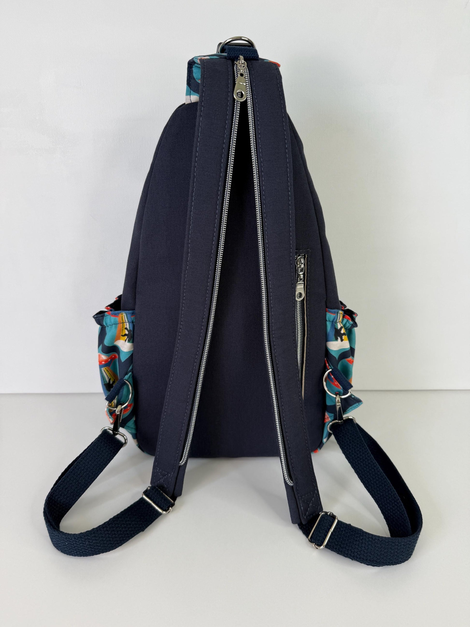 Groovy Alien Abducting Bigfoot Convertible Backpack Crossbody Sling
