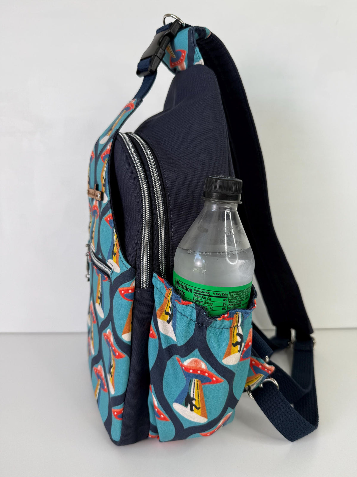 Groovy Alien Abducting Bigfoot Convertible Backpack Crossbody Sling