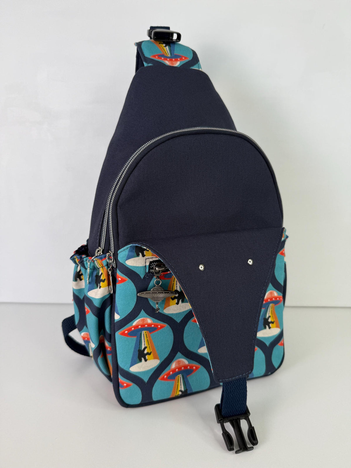 Groovy Alien Abducting Bigfoot Convertible Backpack Crossbody Sling